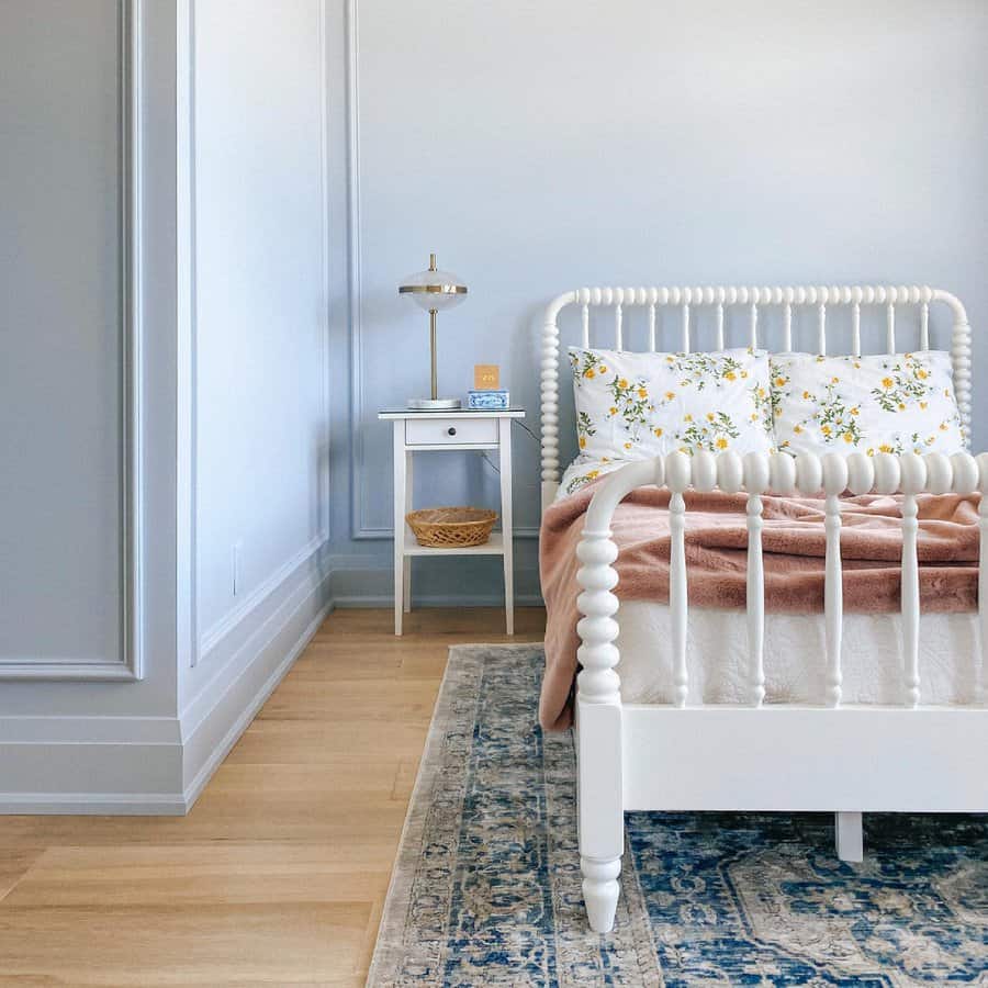 Blue bedroom with white furniture