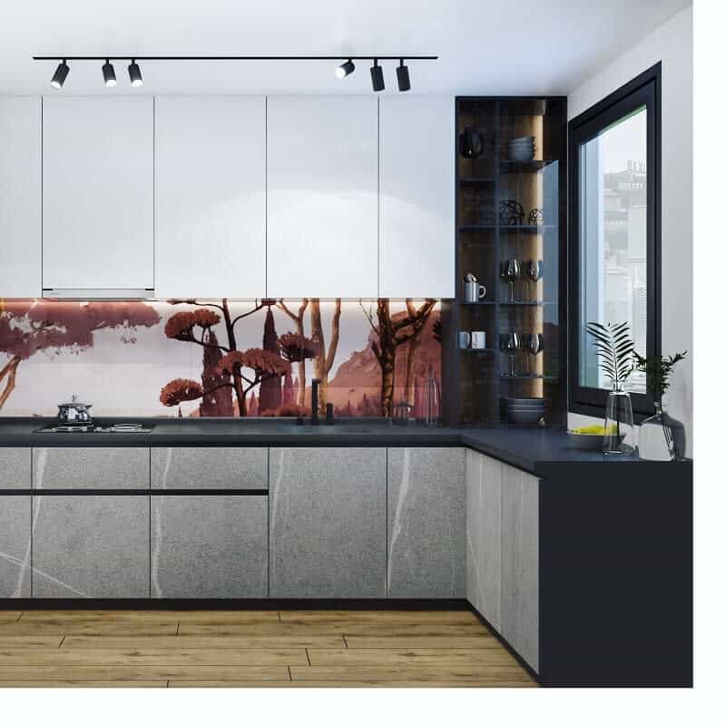 Modern kitchen with white cabinets, a scenic backsplash of trees, black countertop, and a large window with track lighting above