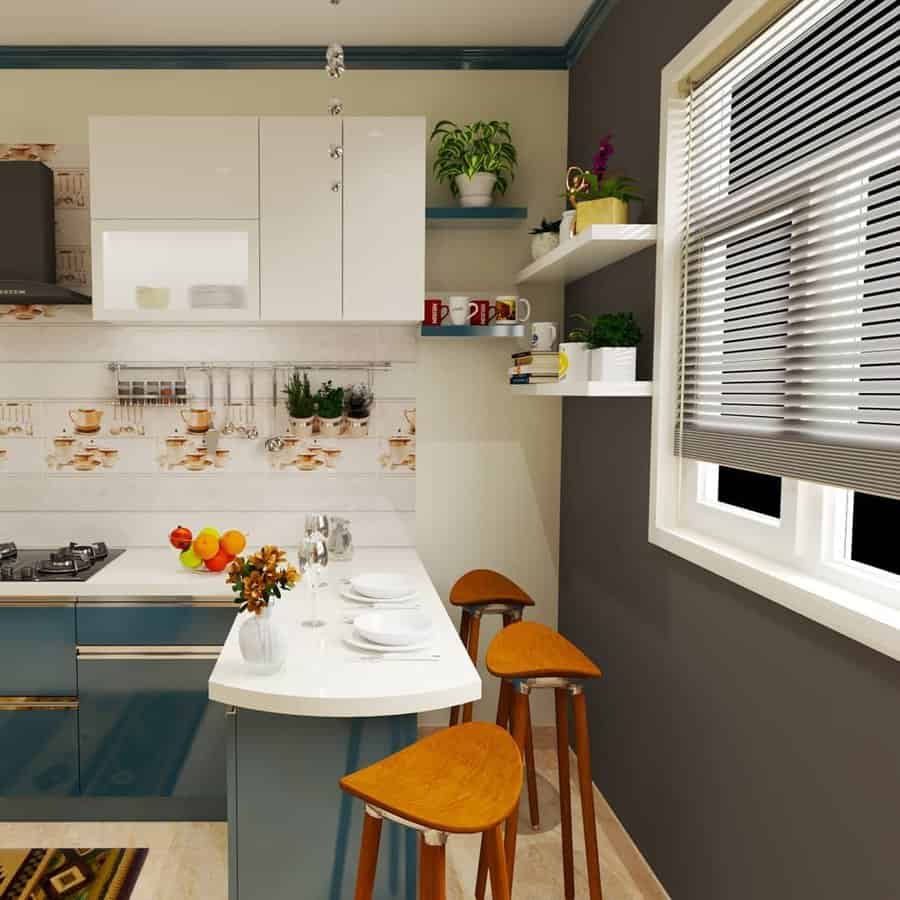 Modern L-shaped kitchen with wooden stools and white countertop