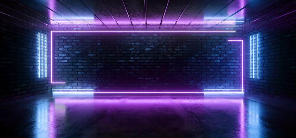 Neon lit room with brick walls and reflective floor