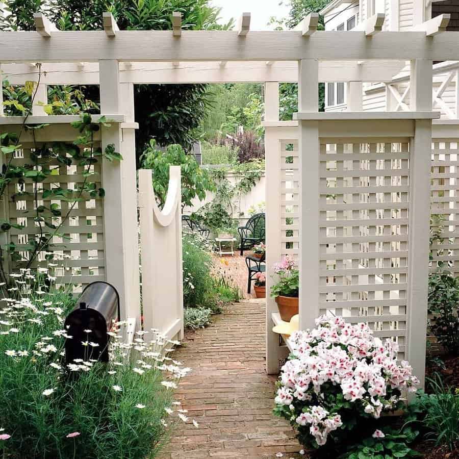 Pergola entryway with lattice and garden