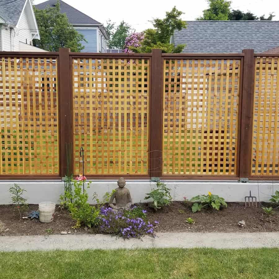 Wooden lattice fence with garden bed
