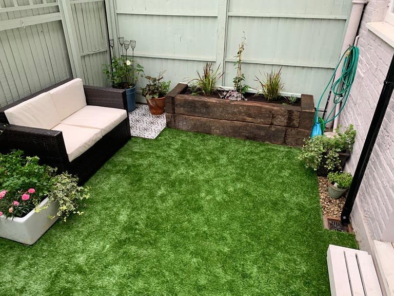 Backyard landscaping with artificial grass