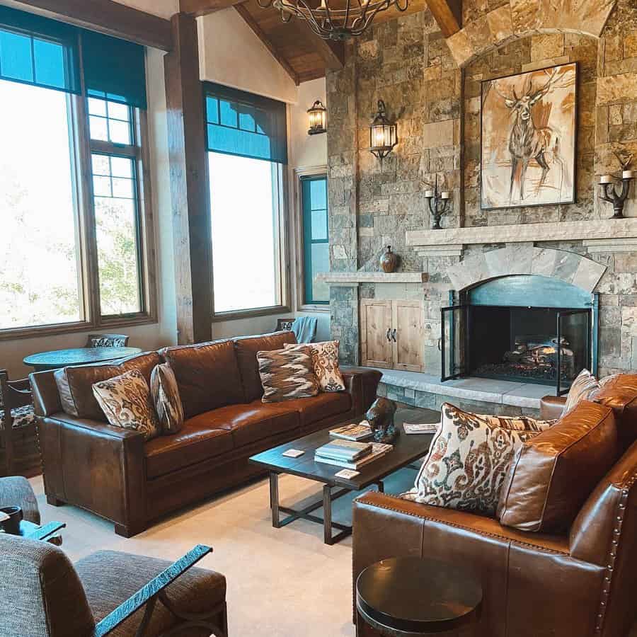 Cozy stone fireplace in a leather furnished living room