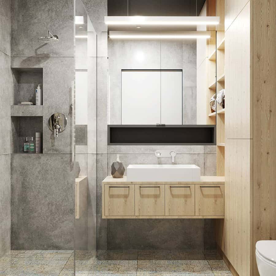 small bathroom with recessed shelves 