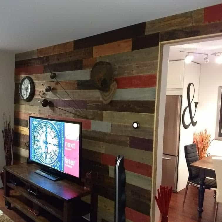 multi-colored wood pallet tv wall