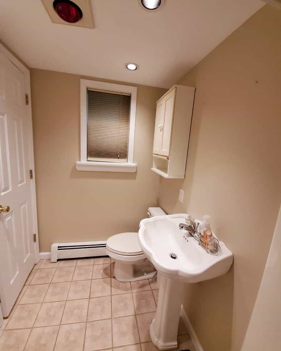 Basement bathroom with window blinds