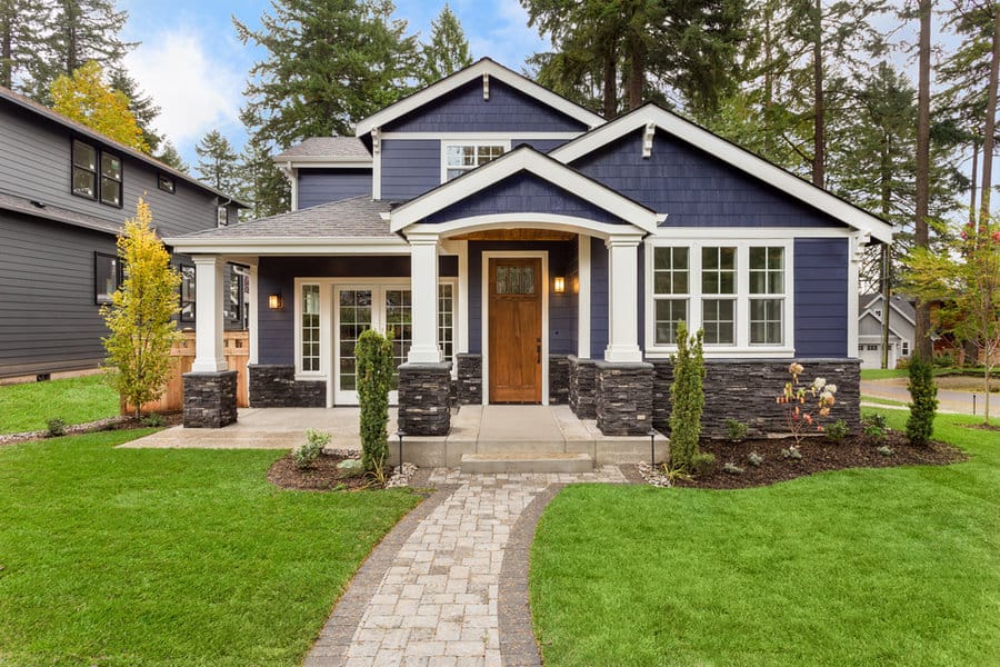 Navy home with stone details and path