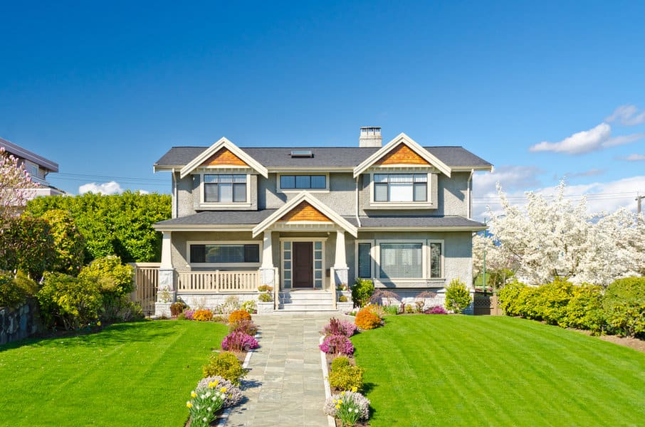 Modern grey house with a landscaped yard