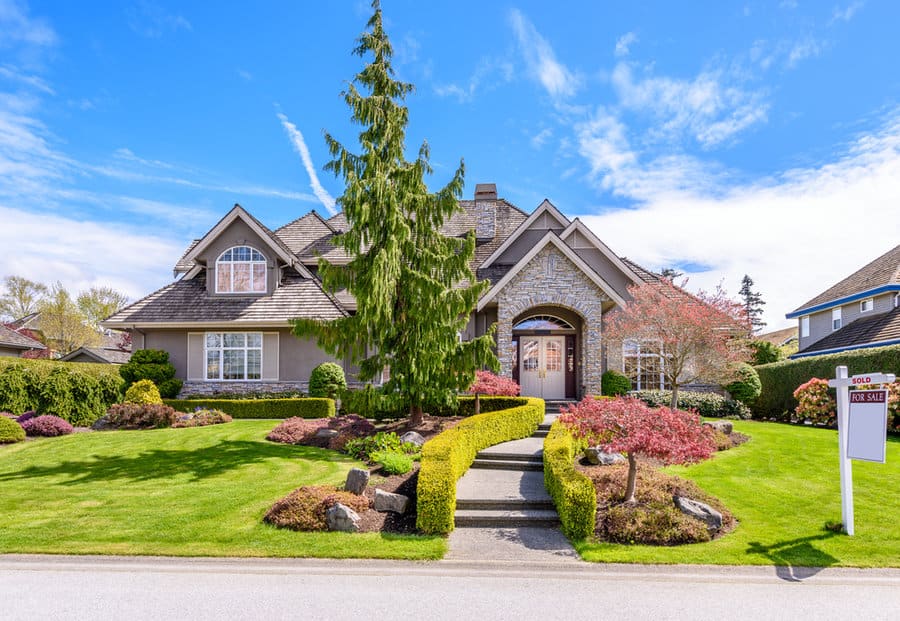 Stately house with manicured lawn 