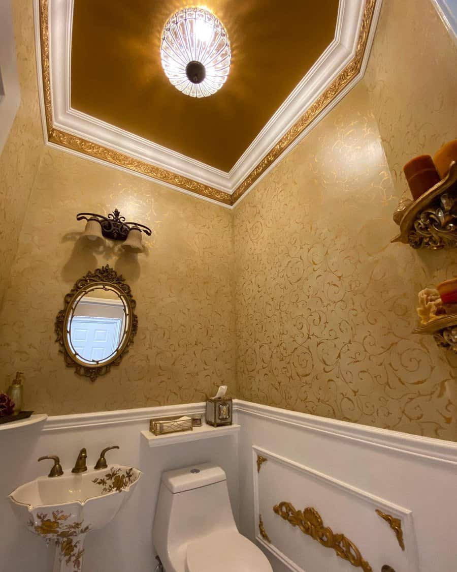 Elegant powder room with a gold tray ceiling, ornate detailing, and crystal lighting, creating a luxurious and sophisticated atmosphere.