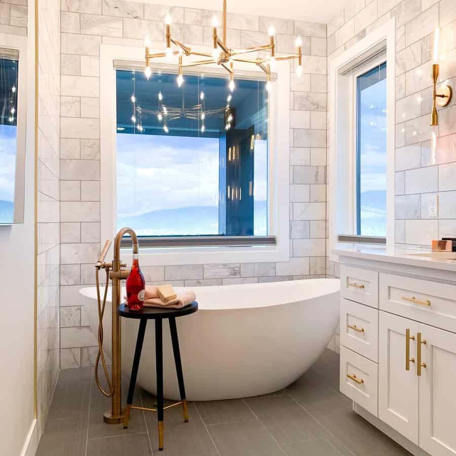 Chic bathroom with gold accents and scenic view