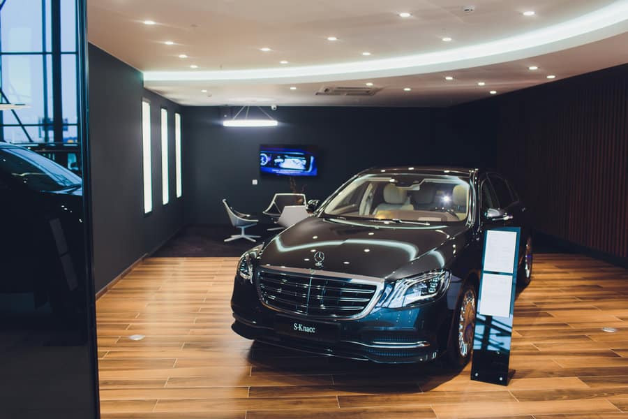 Luxury car showroom with ambient lighting and modern design