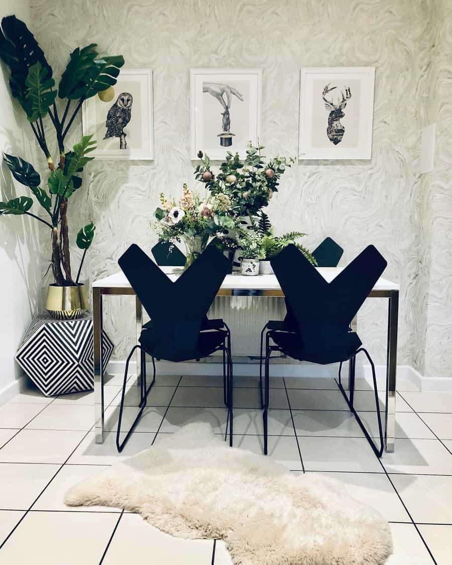 Modern dining room with abstract chairs, a table centerpiece of flowers, framed art, potted plants, and a fur rug on tiled floor