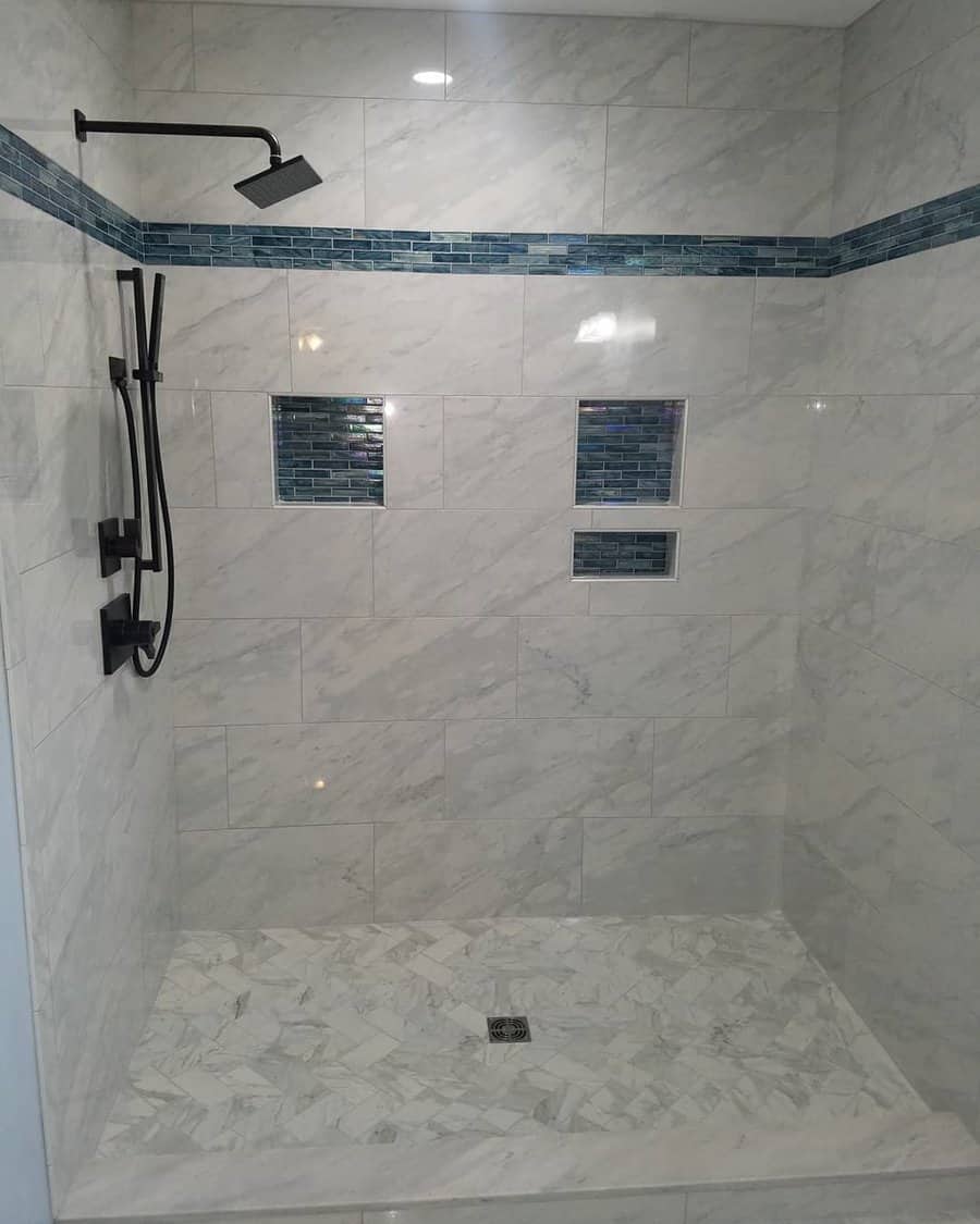 bathroom shower with black fixtures 