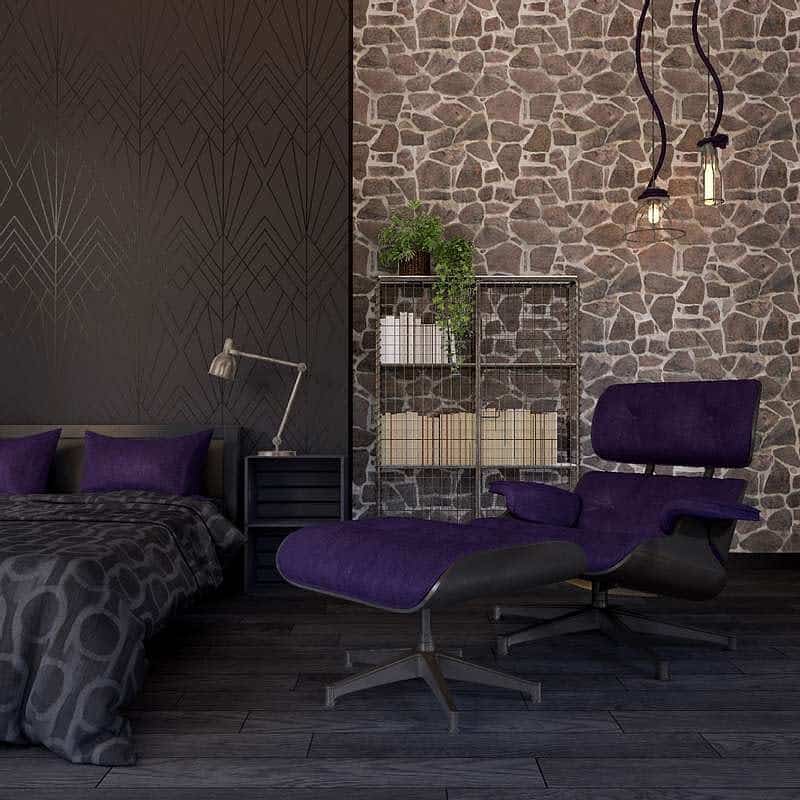 Bold black bedroom with geometric wallpaper, stone accent wall, deep purple chair and bedding, and industrial lighting details