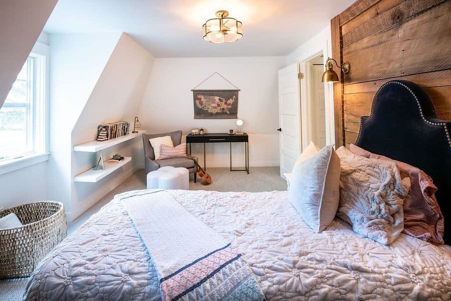 Cozy Zen bedroom with a rustic wood accent wall, soft quilted bedding, built-in shelves, and a serene workspace for a peaceful retreat