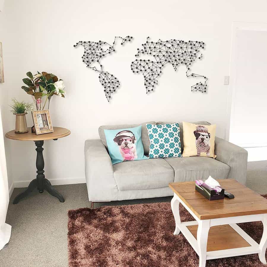 Living room with couch and wall mounted world map