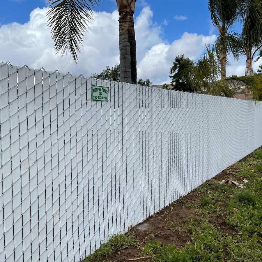 White metal chain link privacy fence