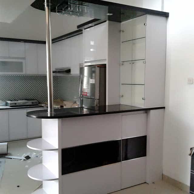 Modern mini-bar in a kitchen with reflective surfaces and shelving