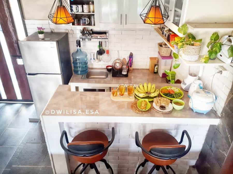 Cozy kitchen bar with snacks and unique pendant lights