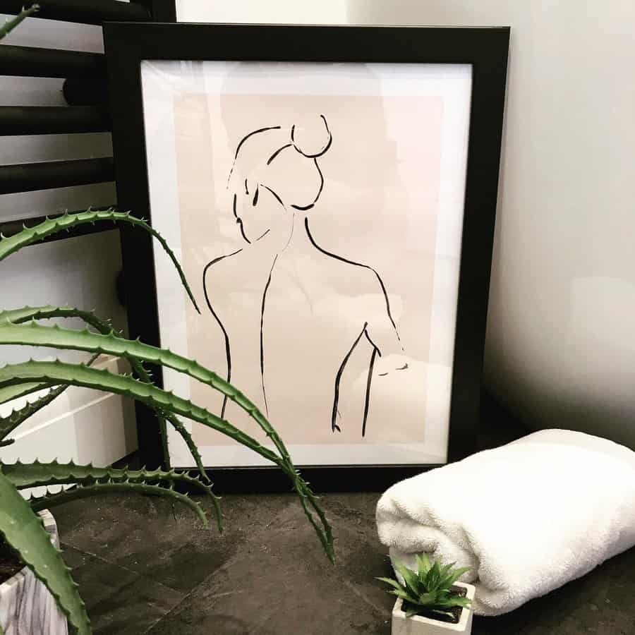 minimal line art in bathroom with plants 