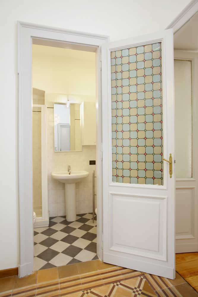 bathroom door with stained glass 