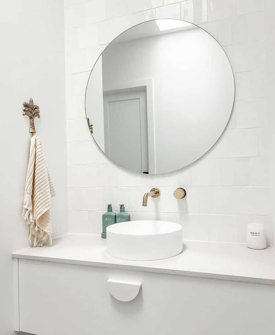 Sleek bathroom with floating vanity and frameless mirror