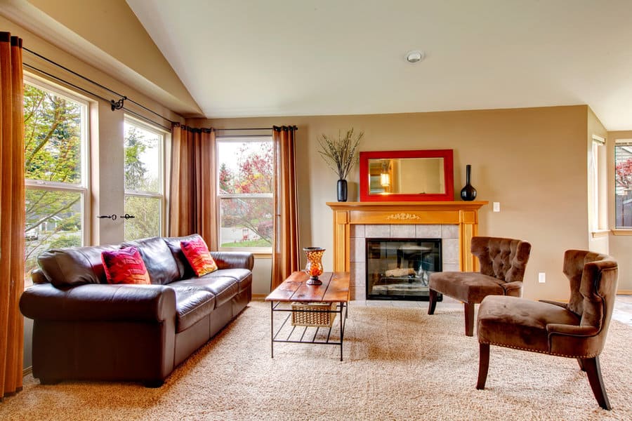 Warm living room with fireplace and leather seating