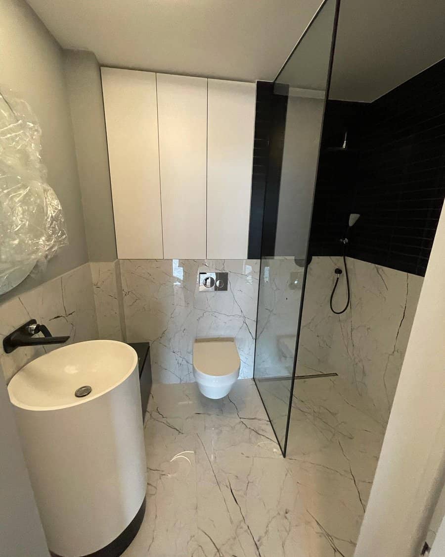 Small bathroom with marble walls