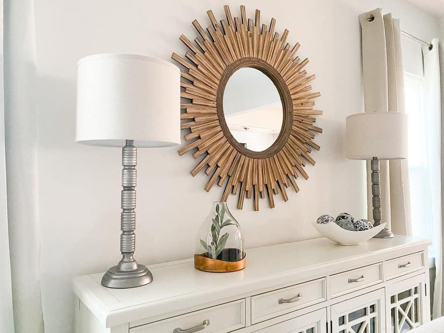 Stylish white console table with mirror and lamps