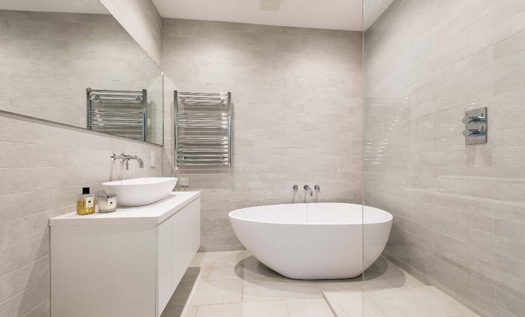 Basement bathroom with wide mirror