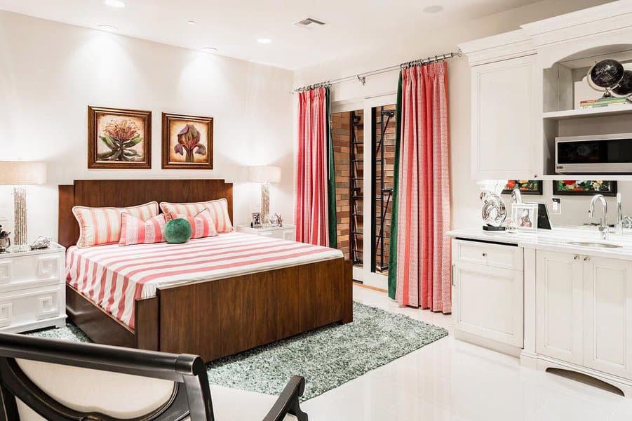 Elegant bedroom with bright stripes and cabinetry