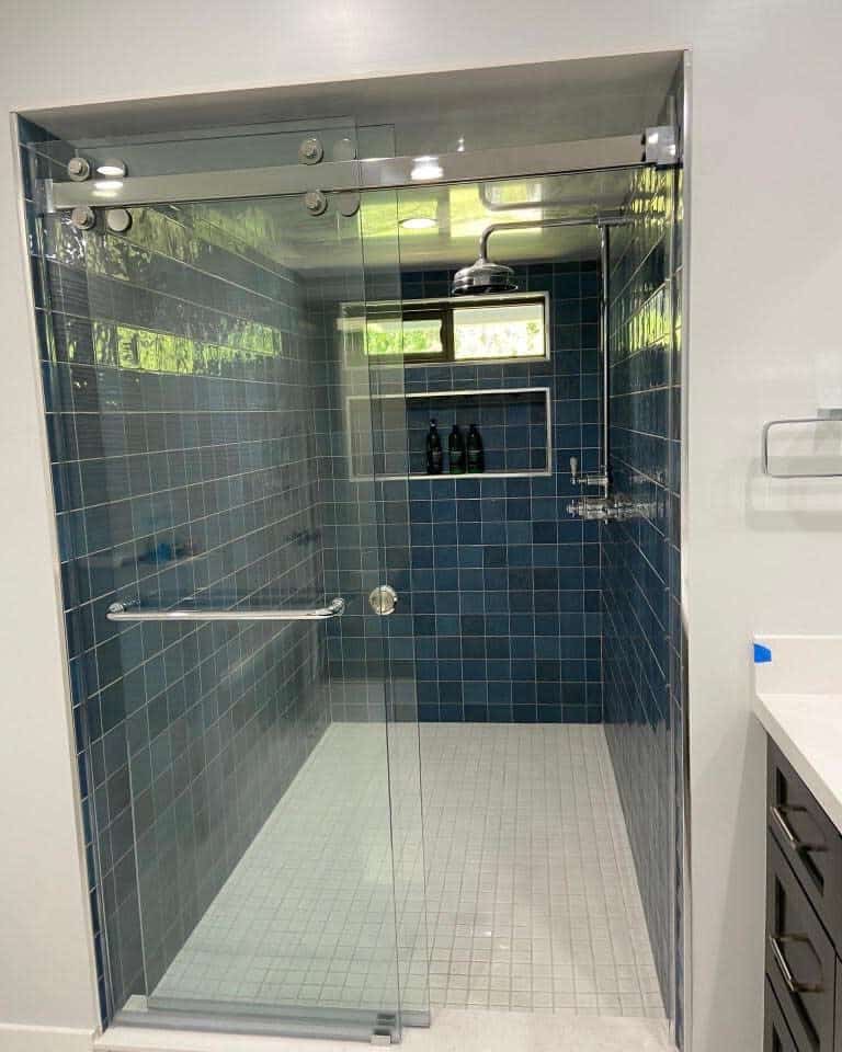 Bathroom shower with blue glass tiles 