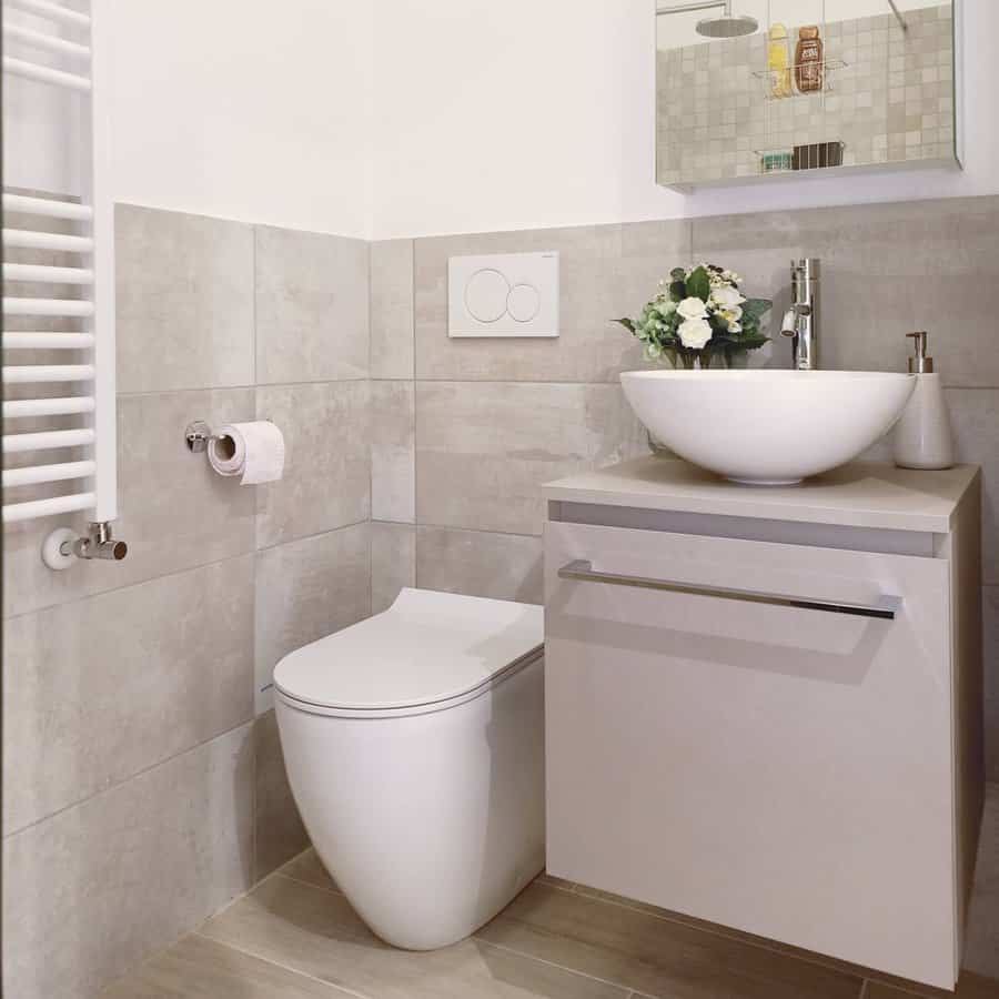 Minimalist bathroom with beige tiles and bowl sink