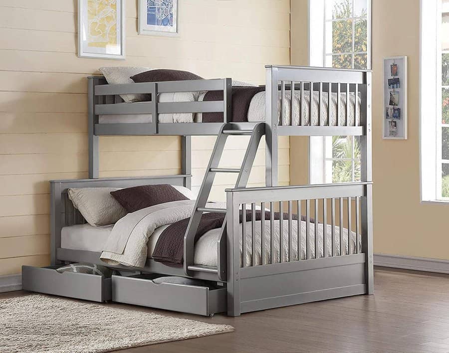 Gray bunk bed with a twin on top and full on bottom, ladder attached, open drawers underneath, and bedding with brown and white pillows