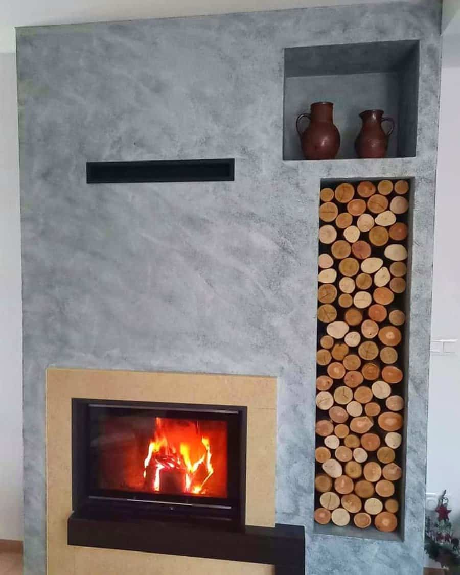 Fireplace wall with recessed shelf for logs