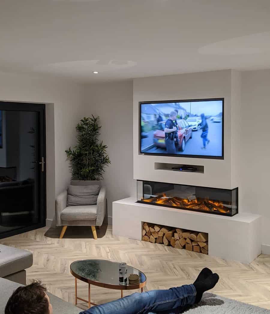 Fireplace wall with recessed shelf for logs