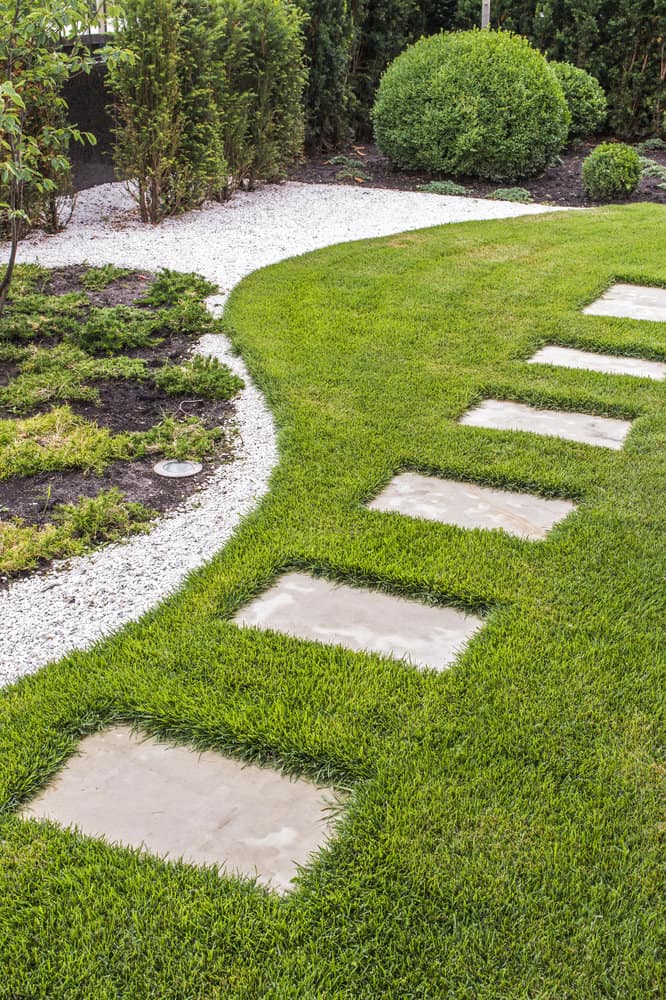 alternating stone and grass garden path