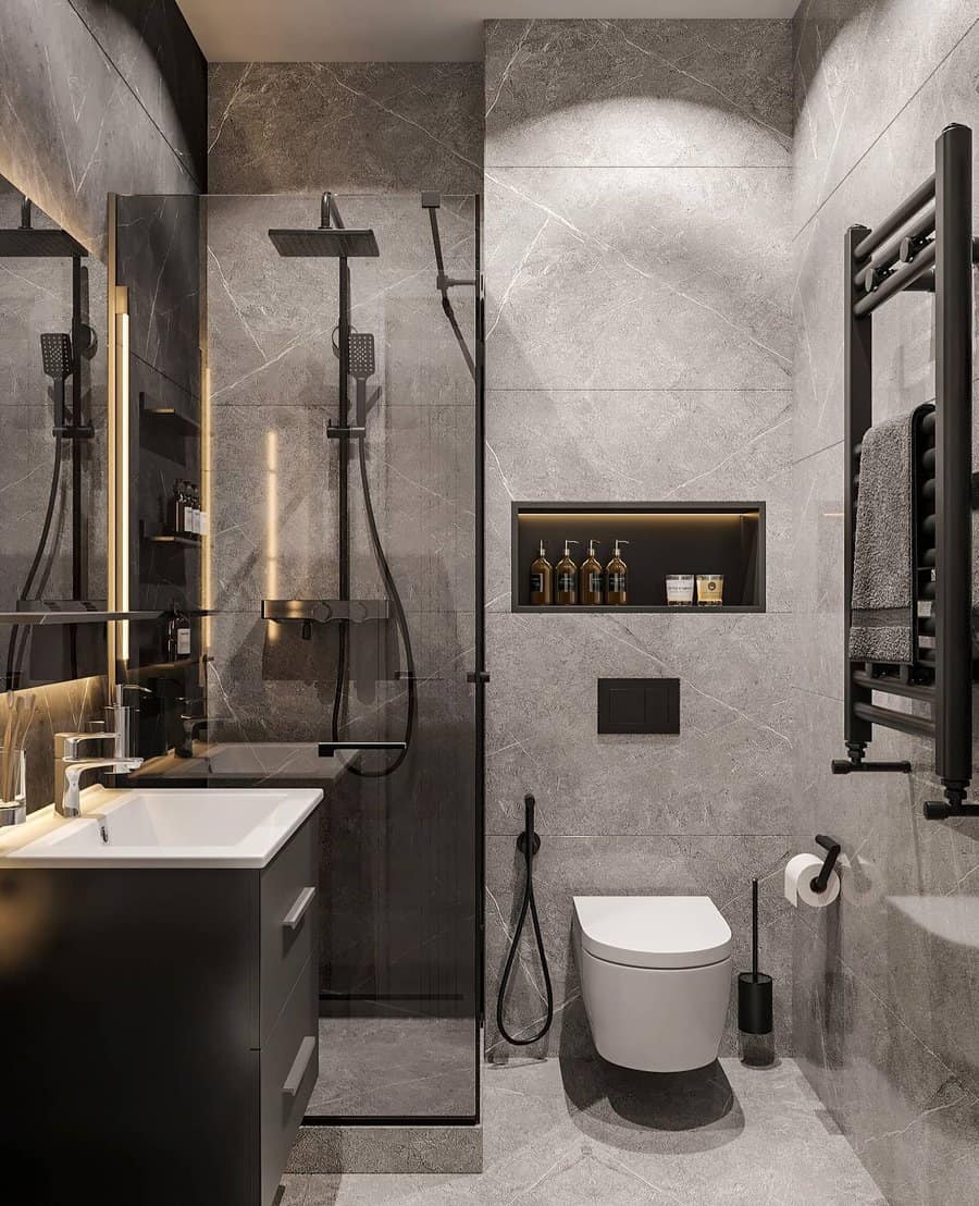 Modern dark gray bathroom with niche and walk in shower