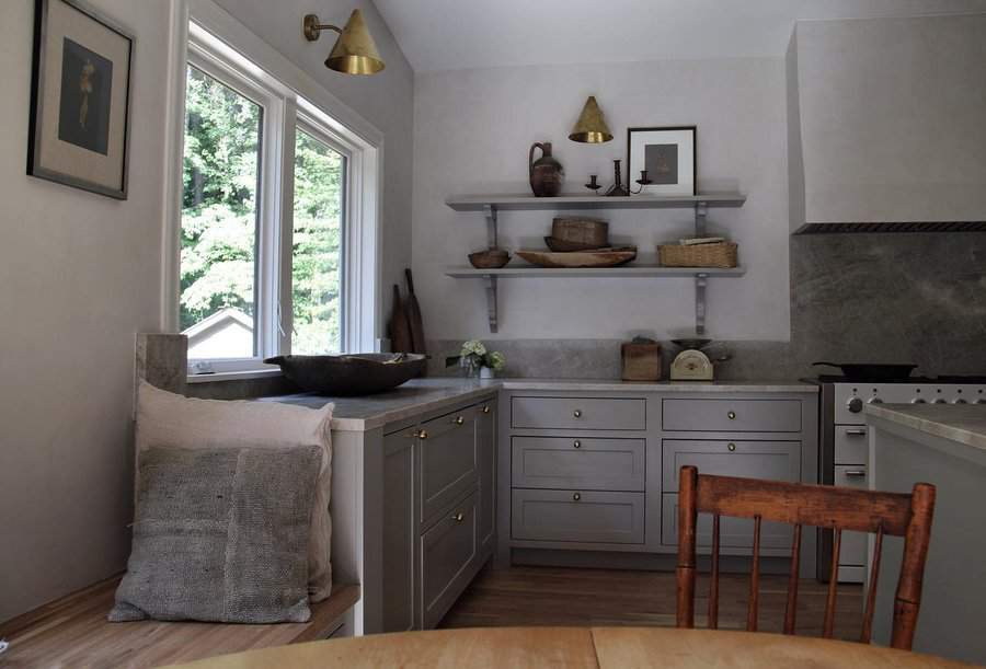 Elegant kitchen with marble countertops and pendant lights