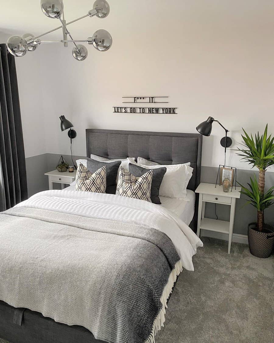 Elegant bedroom with grey tones and a plush tufted headboard