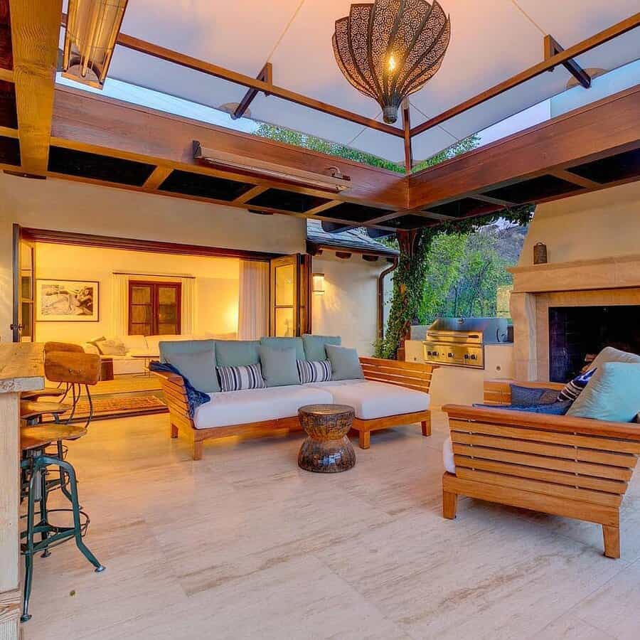 Outdoor living space with fireplace and wooden beams