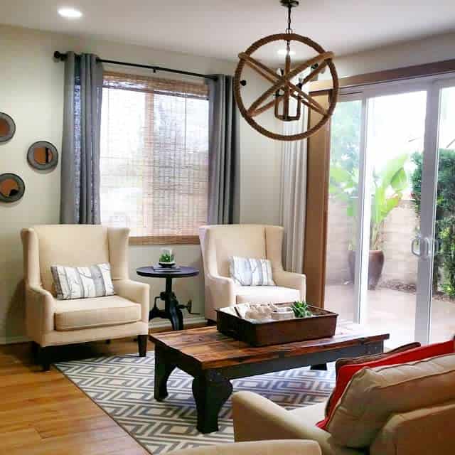 Cozy living room with armchairs and rustic chandelier