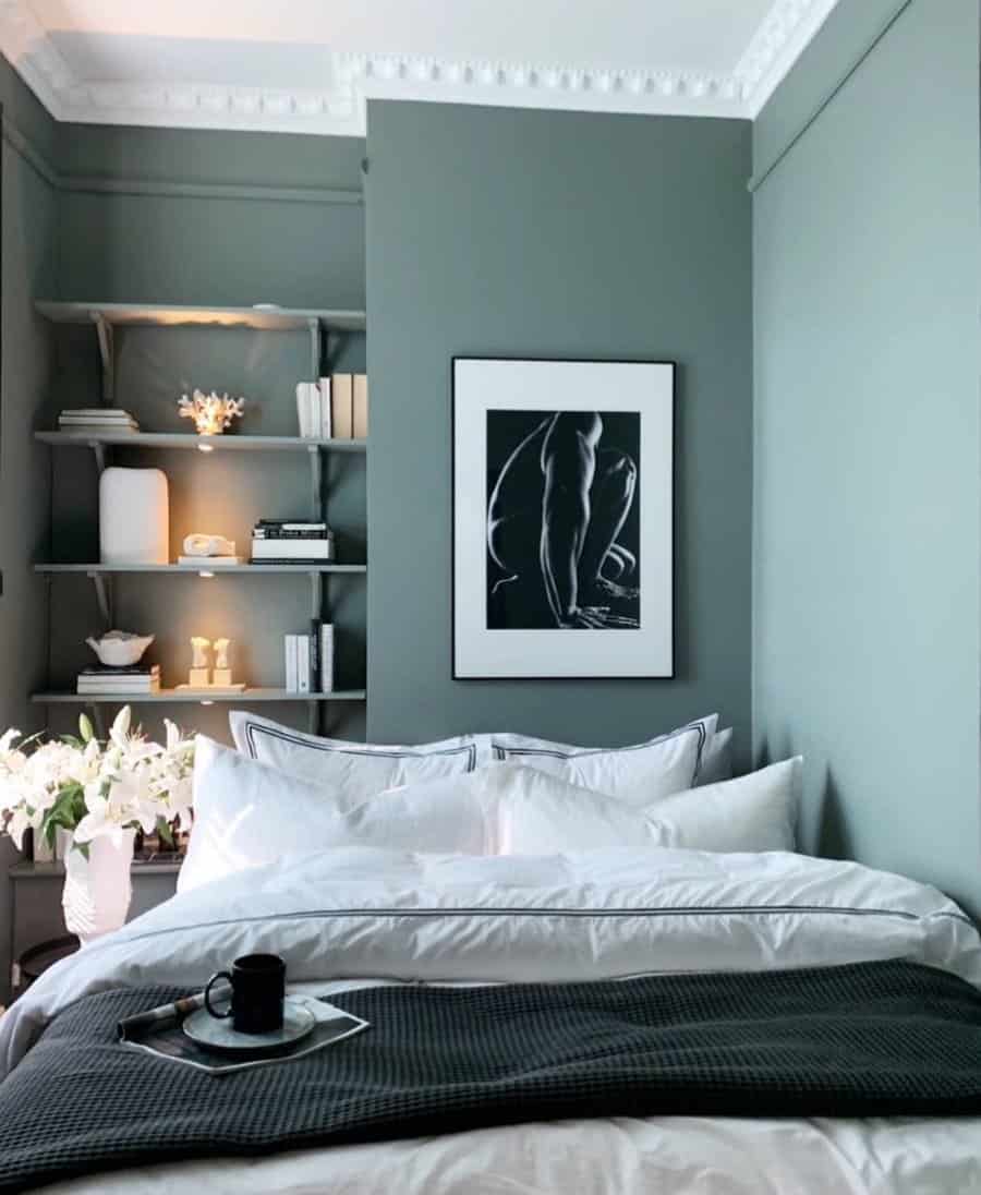 Elegant grey bedroom with shelving and art