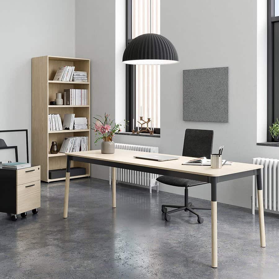 Minimalist office with a desk, chair, and bookshelf. Large windows, hanging lamp, and decoration items create a modern atmosphere