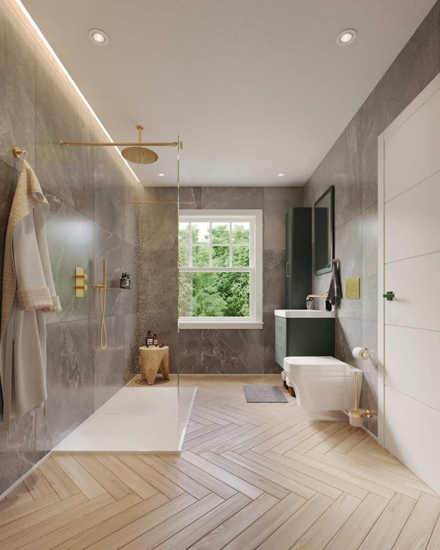 walk-in shower with gold fixtures