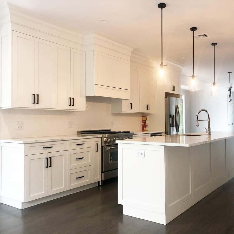 White kitchen with pendant lighting