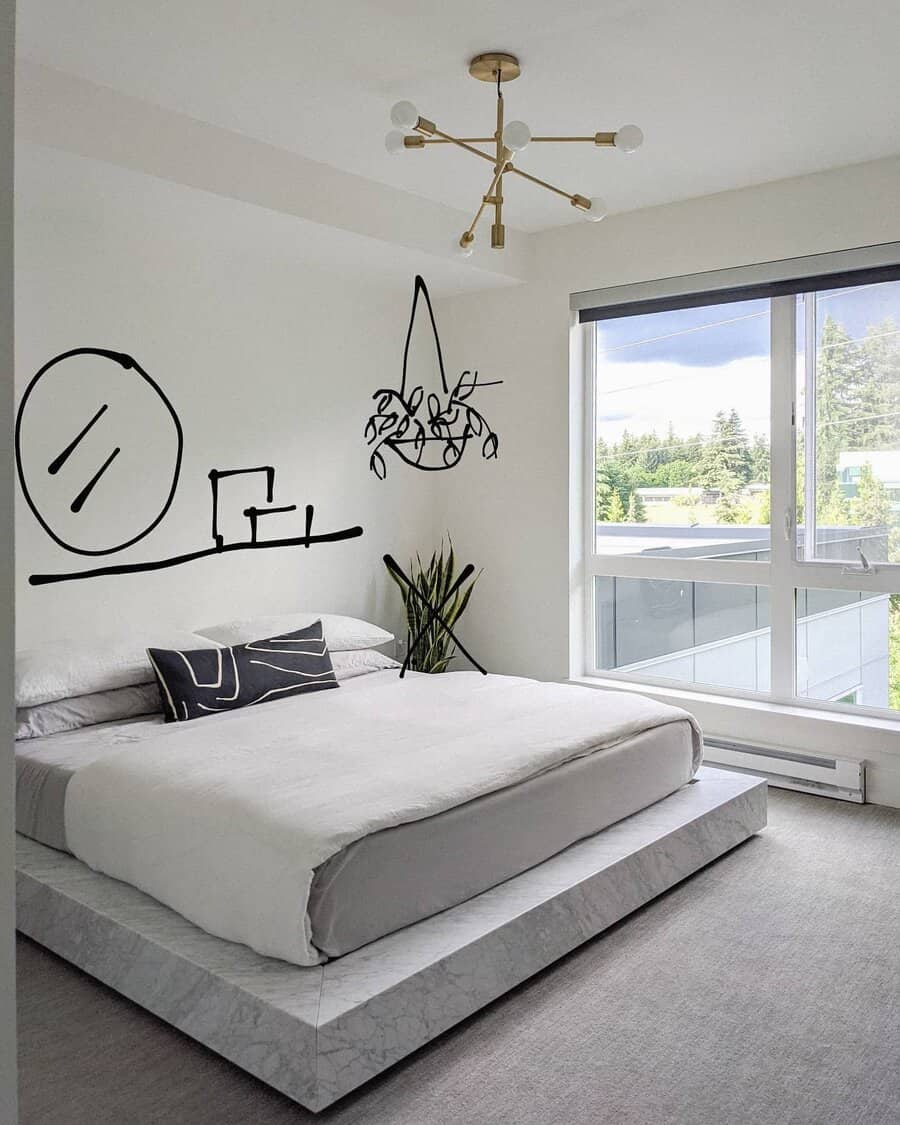 Minimalist bedroom with line art mural and chic chandelier