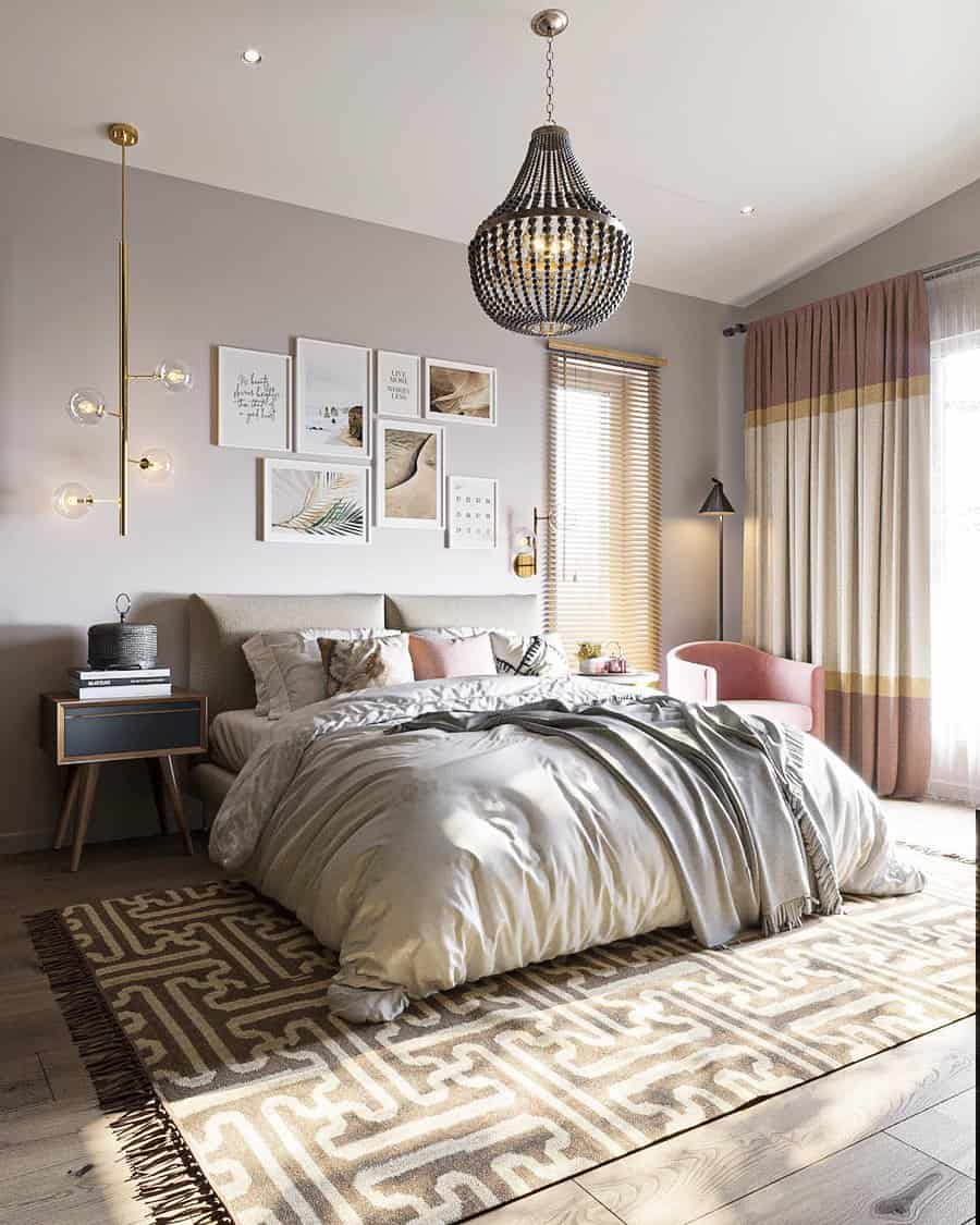 Elegant bedroom with a plush bed, decorative wall art, chandelier, and sheer curtains; warm lighting creates a cozy atmosphere